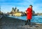 Traveller woman standing on embankment near Notre Dame de Paris