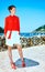 Traveller woman standing in front of lagoon in Donostia, Spain