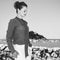 Traveller woman standing in front of lagoon in Donostia, Spain