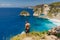 Traveller young man stay near Atuh beach and looks to ocean on Nusa Penida, Indonesia