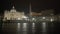 Travellers walking night Saint Peter\'s Square, viewing facade of Papal Basilica