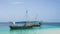 travelling Africa Kenya and Zanzibar seascape with crystal clear turquoise water and traditional sail boat landscape from