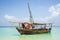 travelling Africa Kenya and Zanzibar seascape with crystal clear turquoise water and traditional sail boat landscape from