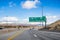 Travelling on the interstate towards Reno; the city`s downtown visible in the background; Nevada