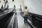 Travelling scene at a train station: young girl and a stairway