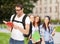 Travelling student with backpack and book