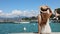 Travels in Italy. Back view of beautiful girl visiting Sirmione on Lake Garda. Summer holidays in Italy. Slow motion.