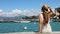 Travels in Italy. Back view of beautiful girl visiting Sirmione on Lake Garda. Summer holidays in Italy. Slow motion.