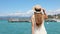 Travels in Italy. Back view of beautiful girl visiting Sirmione on Lake Garda. Summer holidays in Italy. Slow motion.