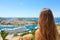 Travels in the Mediterranean. Young woman enjoying Croatia coast view from Dubrovnik city. Summer holidays in Europe