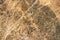 Travertine close up, the texture of brown stone.