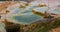 Travertine terraces with hot water of Karahyit Red Springs, Turkey