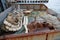 Trawl, pelagic boards, fishing net lies on the fishery deck of a small fishing seiner