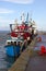 Trawlers berthed in a harbor in Ireland taking shelter during a storm in the Irish Sea