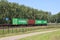 Traxx locomotive with container freight train on track close to Dordrecht