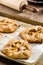 Tray of apple tarts with rolling pin