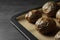 Tray with baked jacket potatoes on table. Space for text