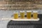 Tray of beer on table isolated on brick backdrop