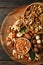 Tray with bowls with different nuts on wooden background