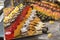 A tray with cakes on a buffet