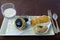 Tray of caviar, smoked salmon tartar potato blinis and creme fraiche appetizers