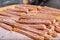 Tray of churros a star-shaped Mexican baked good pastry coated in cinnamon sugar