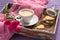 Tray with coffee and cookies on the sheet. Breakfast Valentine`s