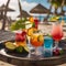 A tray of colorful, exotic cocktails with vibrant, fruity garnishes at a beach bar2