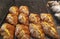 Tray of cream filled almond croissants dusted with icing sugar