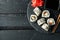 Tray with delicious sushi rolls on background, top view. Japanese food