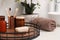 Tray with different toiletries and towel on countertop in bathroom, closeup