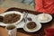 Tray food dining plates vegetables buckwheat porridge tea and sweet on tableware Russia