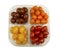 Tray with four variety of fresh tasty mini greenhouse tomatoes