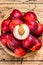 Tray of Fresh red nectarines. Wooden background. Top view