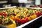 tray of fresh smoked stuffed peppers in a professional kitchen setting