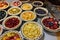 tray of fruit pies and tarts, ready to be baked