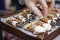 Tray full of cannolis. Hand serving dessert