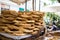 Tray full of Greek traditional round sesame bread rings, displayed in a street market with bokeh background