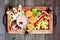 Tray of healthy Halloween fruit snacks, top view over a rustic wood background