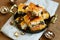 Tray with homemade baklava with honey, nuts and raisin