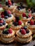 a tray of mini desserts with berries on top