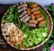 Tray of raw material ready to cook vegan meal for lunch, vegetarian meat, spring roll, mushroom, basil, cucumber