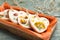 Tray  with scented sachets on blue wooden table, closeup