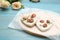 Tray with scented sachets on light blue wooden table