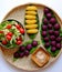 Tray of vegan food from violet sweet potato, boiled banana and salad