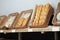 Trays with different breads on shelf