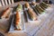 Trays of several types of sushi next to each other during daytime