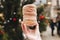 Trdelnik in girls hand, holiday background