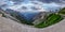 Tre Cime di Lavaredo hiking track with tourists, refuge and deep valley