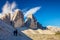 Tre Cime di Lavaredo with tourists silhouettes, Dolomites Alps, Italy